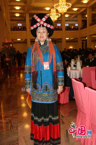 An NPC deputy from the Yi nationality, one of China's 56 ethnic groups, attends the National People's Congress at the Great Hall of the People in Beijing, March 5, 2010. 