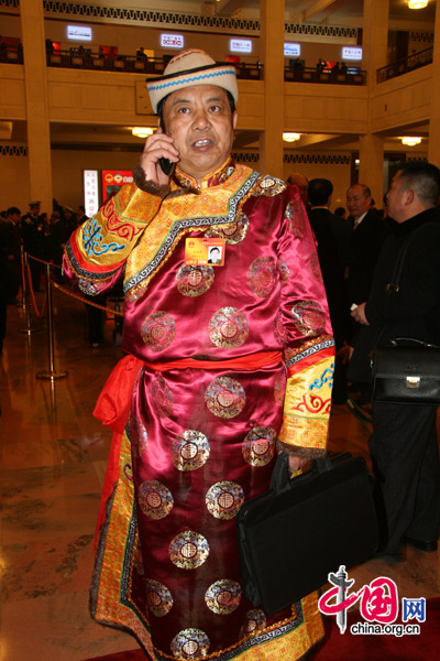 An ethnic minority deputy attends the National People&apos;s Congress at the Great Hall of the People in Beijing, March 5, 2010. 