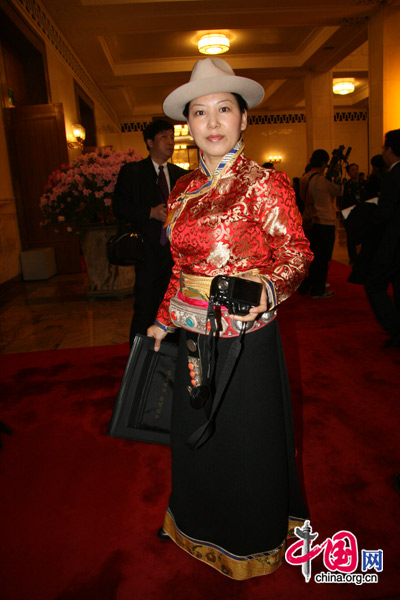 An ethnic minority deputy attends the National People&apos;s Congress at the Great Hall of the People in Beijing, March 5, 2010.