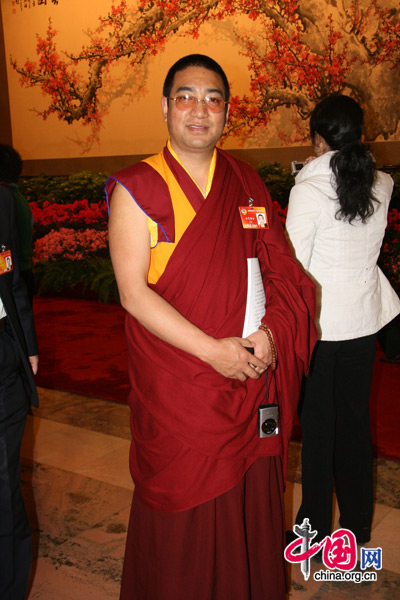 An ethnic minority deputy attends the National People&apos;s Congress at the Great Hall of the People in Beijing, March 5, 2010. 