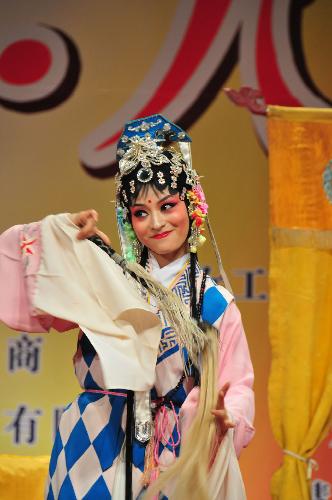 Actress Wang Lujia from Zhejiang Provincial Wu Operal Troupe stage performances during a celebration marking the centennial anniversary of the Women&apos;s Day in Dubai, the United Arab Emirates, March 5, 2010.