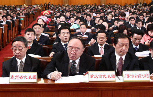 Delegations to the Third Session of the 11th National People&apos;s Congress (NPC) from southwest China&apos;s Guizhou Province, Guangxi Zhuang Autonomous Region and China&apos;s Chongqing Municipality (L to R) attend the opening meeting of the Third Session of the 11th NPC at the Great Hall of the People in Beijing, capital of China, March 5, 2010.