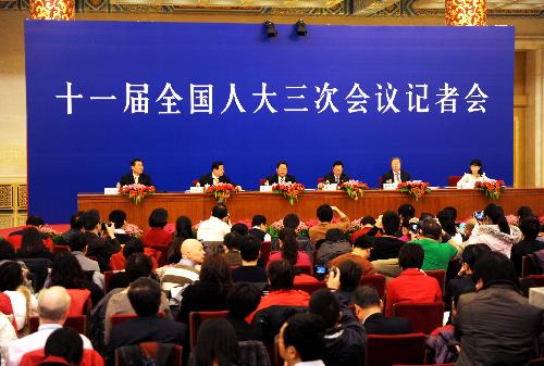 Zhang Ping, Chairman of National Development and Reform Commission (NDRC), Xie Xuren, the Minister of Finance, Chen Deming, the Minister of Commerce, and Zhou Xiaochuan, governor of the People's Bank of China, attend a news conference of the Third Session of the 11th National People's Congress (NPC) on the enhancement and improvement of macro-economic control held at the Great Hall of the People in Beijing, China, March 6, 2010.