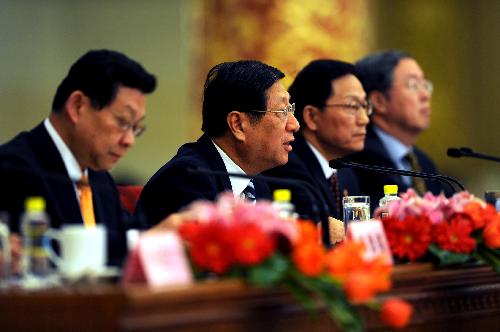 Zhang Ping, Chairman of National Development and Reform Commission (NDRC), Xie Xuren, the Minister of Finance, Chen Deming, the Minister of Commerce, and Zhou Xiaochuan, governor of the People's Bank of China, attend a news conference of the Third Session of the 11th National People's Congress (NPC) on the enhancement and improvement of macro-economic control held at the Great Hall of the People in Beijing, China, March 6, 2010.