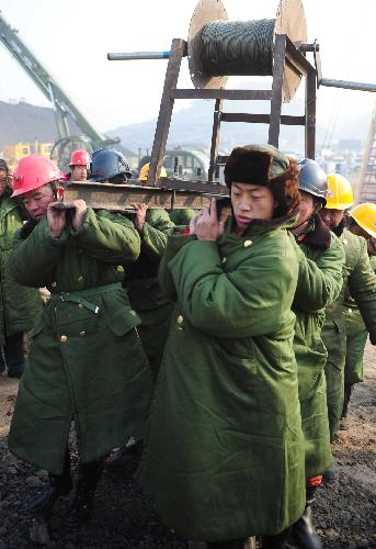 Rescuers prepare to send sound and light instruments to mining platform undrground at the site of flooded coal mine in Wuhai, north China&apos;s Inner Mongolia Autonomous Region, March 6, 2010.