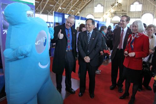 Chinese Ambassador to Canada Lan Lijun (front 2nd L) and Canadian officials visit the picture exhibition featuring The 2010 Shanghai World Expo in Ottawa, Canada, March 7, 2010. 
