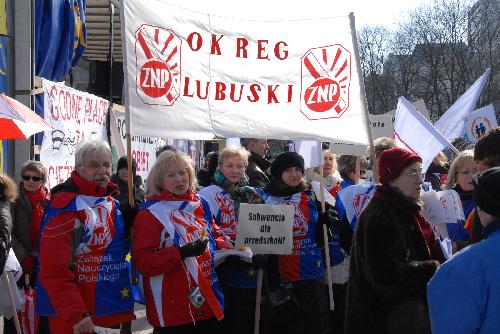People attend a parade marking the centennial anniversary of the International Women's Day in Warsaw, capital of Poland, March 7, 2010. 