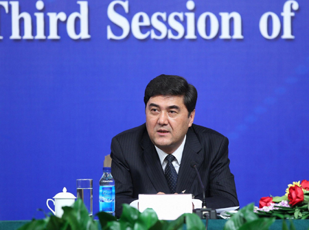 Nur Berkri, chairman of the Xinjiang Uygur autonomous regional government, speaks at a press conference on the sidelines of an ongoing session of the National People's Congress, the top legislature, in Beijing, March 7, 2010.