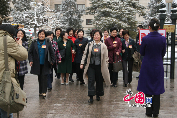 Women deputies are seen at a meeting venue during the Third Session of the 11th National People&apos;s Congress.