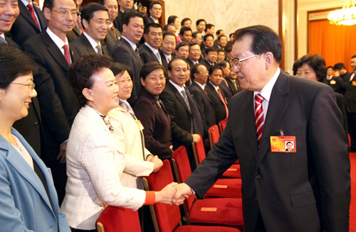 Speaking to NPC deputies from Fujian Province, Li Changchun, a Standing Committee member of the Political Bureau of the Communist Party of China (CPC) Central Committee, called for vigorous publicity efforts on the transformation of the economic development pattern, in Beijing, capital of China, March 8, 2010.