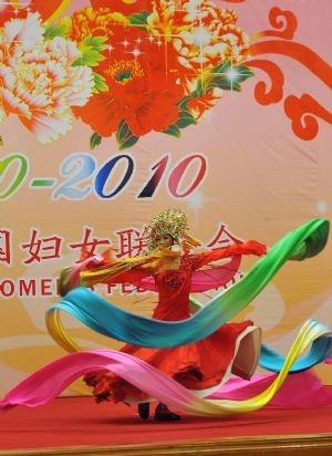 Actor Li Yugang performs during a reception organized by All-China Women&apos;s Federation for women from China and abroad to mark the 100th anniversary of the International Women&apos;s Day, at the Great Hall of the People in Beijing, capital of China, March 8, 2010. 