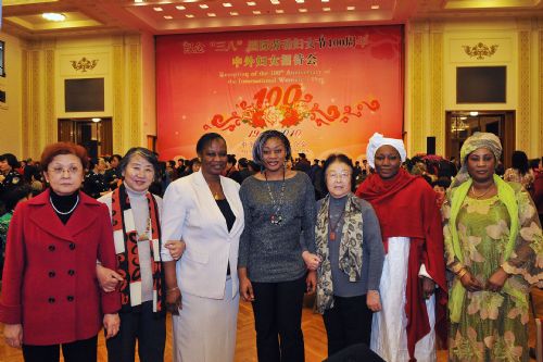 Attendees pose for a photo during a reception organized by All-China Women's Federation for women from China and abroad to mark the 100th anniversary of the International Women's Day, at the Great Hall of the People in Beijing, capital of China, March 8, 2010.