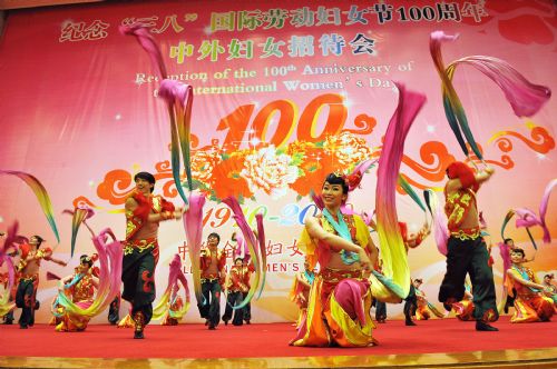 Dancers perform during a reception organized by All-China Women's Federation for women from China and abroad to mark the 100th anniversary of the International Women's Day, at the Great Hall of the People in Beijing, capital of China, March 8, 2010.