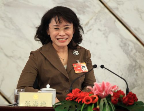 Zhang Haidi, member of the 11th National Committee of the Chinese People's Political Consultative Conference (CPPCC), answers questions by journalists during a news conference held by the Third Session of the 11th National Committee of the CPPCC on the 2010 Shanghai World Expo in Beijing, capital of China, March 8, 2010.