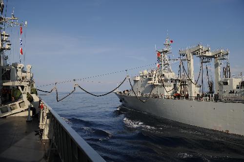 China's 'Weishanhu' supply ship (R) refuels missile destroyer 'Guangzhou' during the task of replenishment in the Indian Ocean, March 9, 2010. 