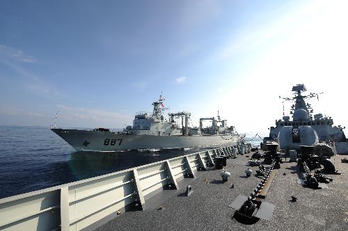 China's 'Weishanhu' supply ship (L) refuels missile destroyer 'Guangzhou' during the task of replenishment in the Indian Ocean, March 9, 2010. 