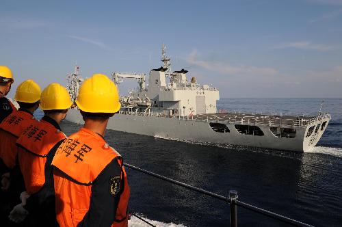 China's missile destroyer 'Guangzhou' (Front) sails close to 'Weishanhu' supply ship during the task of replenishment in the Indian Ocean, March 9, 2010. 