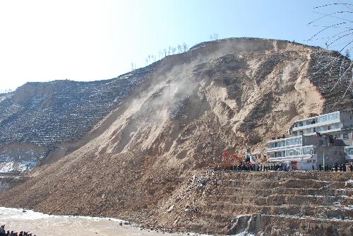 This photo taken on March 10, 2010 shows the site of a landslide at Shuanghuyu Village in Zizhou County, northwest China's Shaanxi Province. The landslide, which occurred on Wednesday, has left nine people dead and 19 others missing. Sixteen people have been rescued.