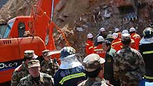 Rescuers work at the site of a landslide at Shuanghuyu Village in Zizhou County, northwest China's Shaanxi Province, March 10, 2010. The landslide, which occurred on Wednesday, has left nine people dead and 19 others missing. Sixteen people have been rescued.
