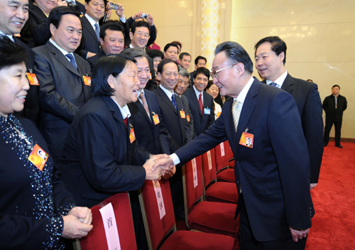Wu Bangguo (R, front), chairman of the Standing Committee of the National People&apos;s Congress (NPC), joins a panel discussion with deputies to the Third Session of the 11th NPC from north China&apos;s Shanxi Province in Beijing, China, March 10, 2010. 