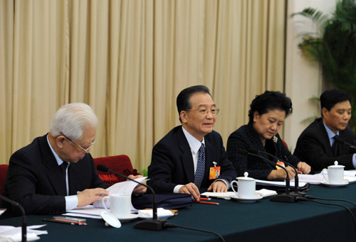 Chinese Premier Wen Jiabao (2nd, L) joins a panel discussion with deputies to the Third Session of the 11th National People's Congress from north China's Hebei Province in Beijing, China, March 10, 2010. 