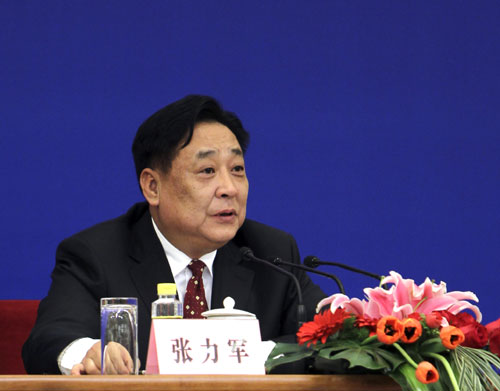 Zhang Lijun, Vice Minister of Environmental Protection, answers a question during a press conference on energy-saving emission reduction and climate change held on the sidelines of the Third Session of the 11th National People's Congress in Beijing, capital of China, March 10, 2010.
