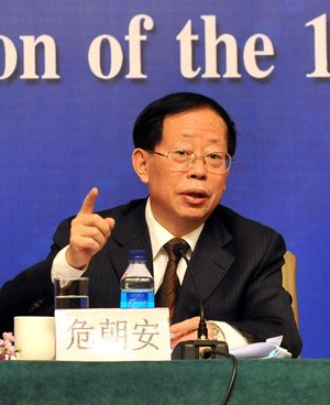 Wei Chaoan, China's vice Agriculture Minister, answers a question during a press conference on the development of China's agriculture and rural economy held on the sidelines of the Third Session of the 11th National People's Congress in Beijing, capital of China, March 10, 2010.