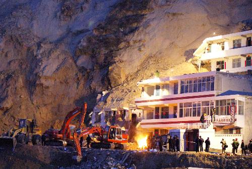 Rescuers are busy on the site where a landslide occurred in Zizhou County of Yulin City, northwest China&apos;s Shaanxi Province, on March 10, 2010.