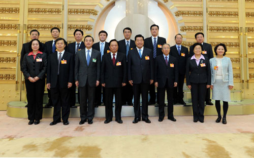Jia Qinglin (4th R, front), chairman of the National Committee of the Chinese People&apos;s Political Consultative Conference (CPPCC), joins a panel discussion with deputies to the Third Session of the 11th National People&apos;s Congress (NPC) from southeast China&apos;s Taiwan Province in Beijing, capital of China, March 11, 2010. 