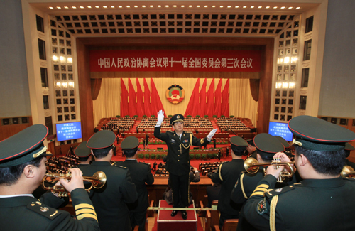 The military band plays during the closing ceremony of the Third Session of the 11th National Committee of the Chinese People's Political Consultative Conference (CPPCC) at the Great Hall of the People in Beijing, capital of China, March 13, 2010.