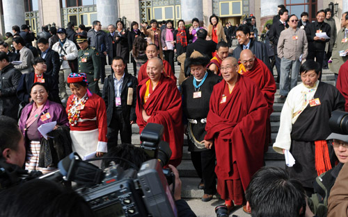 CPPCC National Committee members walk out of the Great Hall of the People in Beijing after the closing ceremony of the CPPCC annual session, March 13, 2010. 