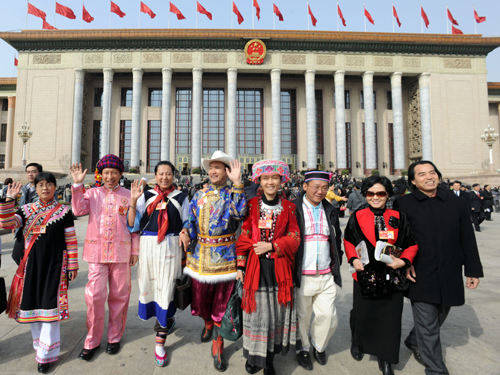 Members of the 11th National Committee of the Chinese People's Political Consultative Conference (CPPCC) leave the Great Hall of the People in Beijing, capital of China, March 13, 2010. 