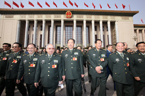 Members of the 11th National Committee of the Chinese People's Political Consultative Conference (CPPCC) leave the Great Hall of the People in Beijing, capital of China, March 13, 2010. 