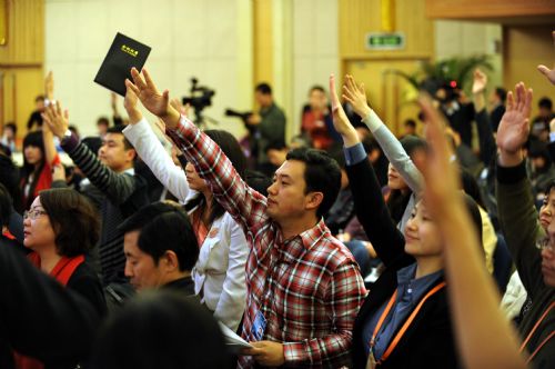 Journalists work during a press conference on high-speed railway construction and development in China held on the sidelines of the Third Session of the 11th NPC in Beijing, China, March 13, 2010.