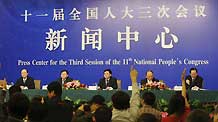 Journalists raise questions during a press conference on high-speed railway construction and development in China held on the sidelines of the Third Session of the 11th NPC in Beijing, China, March 13, 2010.