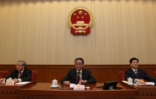 Wu Bangguo (C), chairman of the Standing Committee of the National People's Congress (NPC), presides over the fourth meeting of the presidium of the Third Session of the 11th NPC at the Great Hall of the People in Beijing, capital of China, March 13, 2010. 