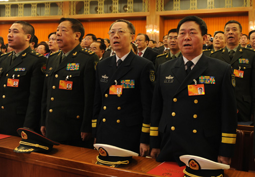 Deputies to the Third Session of the 11th National People's Congress (NPC) sing the national anthem during the closing meeting of the Third Session of the 11th NPC at the Great Hall of the People in Beijing, China, March 14, 2010. 