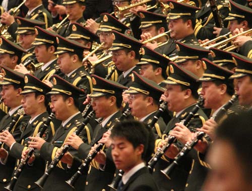 The military band plays during the closing meeting of the Third Session of the 11th National People's Congress at the Great Hall of the People in Beijing, China, March 14, 2010.