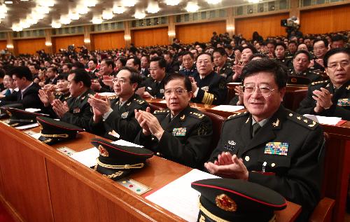 Deputies to the Third Session of the 11th National People's Congress (NPC) attend the closing meeting of the Third Session of the 11th NPC at the Great Hall of the People in Beijing, China, March 14, 2010. 