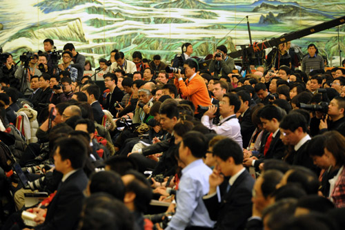 Journalists work during Chinese Premier Wen Jiabao's meeting with the press after the closing meeting of the Third Session of the 11th National People's Congress (NPC) at the Great Hall of the People in Beijing, China, March 14, 2010. 