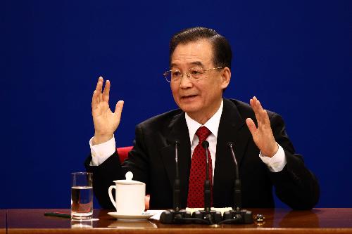 Chinese Premier Wen Jiabao answers questions during a press conference after the closing meeting of the Third Session of the 11th National People's Congress (NPC) at the Great Hall of the People in Beijing, capital of China, March 14, 2010.