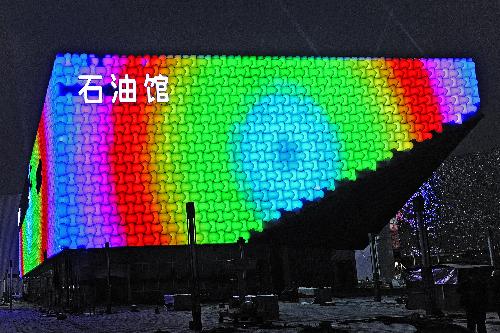The Oil Pavilion of the 2010 Shanghai World Expo is illuminated in a test run in Shanghai, east China. 