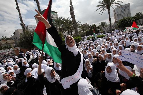 Palestinian school-girls chant slogans during a rally against Israel's consecration of a synagogue in Jerusalem's Old City, in Gaza City on March 16, 2010.