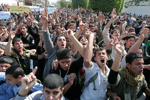 Palestinian youths chant slogans during a rally against Israel's consecration of a synagogue in Jerusalem's Old City, in Khan Yunis in southern Gaza strip on March 16, 2010.