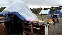 A resident rests in a tent in Conception, Chile, on March 17, 2010. A 8.8-magnitude earthquake battered the Chilean city.