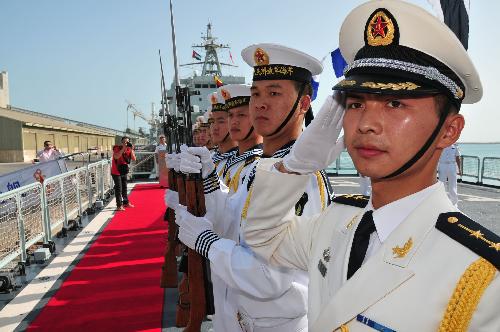 Honour guards of the Chinese Navy stand on the deck of the Chinese Frigate Maanshan during a welcoming ceremony in Abu Dhabi, capital of the United Arab Emirates (UAE), March 24, 2010.