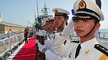 Honour guards of the Chinese Navy stand on the deck of the Chinese Frigate Maanshan during a welcoming ceremony in Abu Dhabi, capital of the United Arab Emirates (UAE), March 24, 2010.