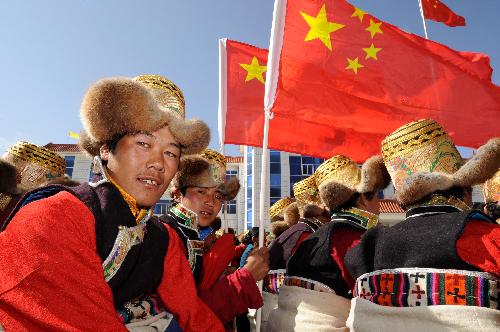 Local residents attend celebration for the upcoming Serfs Emancipation Day in Zhanang County, southwest China&apos;s Tibet Autonomous Region, March 26, 2010. 