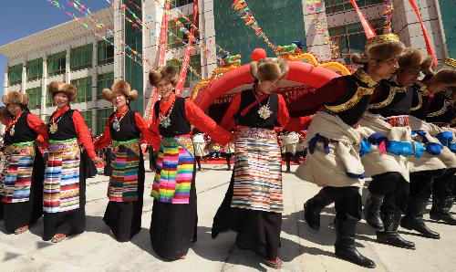 Local residents dance during a celebration for the upcoming Serfs Emancipation Day in Zhanang County, southwest China&apos;s Tibet Autonomous Region, March 26, 2010. 