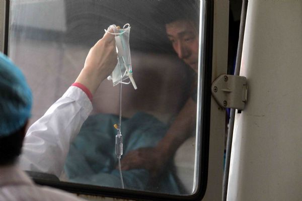 A rescued miner from the flooded Wangjialing Coal Mine is taken to the Renmin Hospital in Hejin City in north China's Shanxi Province, on April 5, 2010. The Renmin Hospital took 48 survivors from the mine and planed to take another 12 survivors from the mine. 